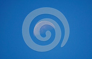A crescent moon in the blue sky