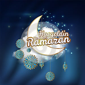 Crescent moon and calligraphy inscription which means `` Hosgeldin Ya Sehri Ramazan`` on night cloudy background. translation: Ram