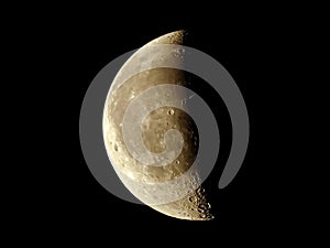 Crescent moon close up with shadows and craters.