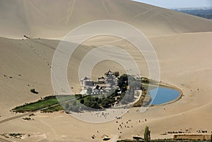 Crescent moon lake in desert