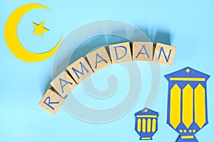 Crescent moon, star and lantern decoration with text. Ramadan Kareem celebration.