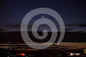 Night with crescent moon and clouds photo