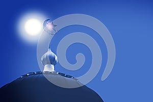 Crescent and star, symbol of Islam on dome of the mosque with blue sky