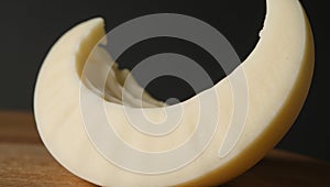 A crescentshaped moon constructed from white cheese