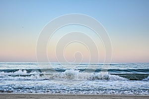 Crest of a wave in the Black Sea at sunset, selective focus. Sea waves background series images