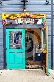 Open door of Bonez Tequila Bar & Grill on main street of Crested Butte ski resort town with