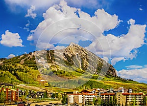 Crested Butte Colorado USA. Ski lodges sit at bottom on mountain in springtime