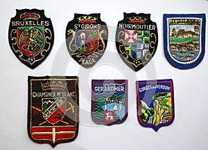 Crests, patches, coats of arms. Souvenirs from France, Belgium and Germany.  Colorful, shiny and elaborately embroidere