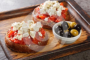 Cretan dakos is for a traditional salad from the island of Crete consists of barley rusk topped with juicy tomatoes, cheese and