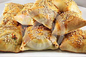 Cretan pies with sesame seeds photo