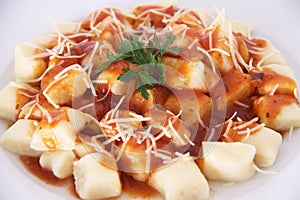 Gnocchi with tomatoe sauce parmesian isolated white background Sao Paulo Brazil