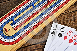 Cribbage board and playing cards