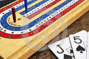 Cribbage board and playing cards