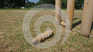 Cricket bails knocked off a set of stumps