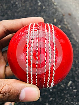 A cricket ball is a hard, solid ball used to play cricket