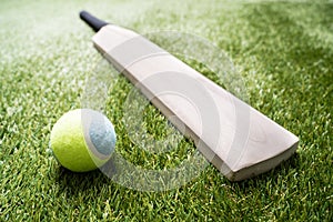 Cricket Bat And Ball On Turf Grass