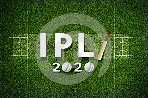 Cricket bat and leather ball resting on a cricket bat with ipl 2020 text placed on green grass cricket ground pitch,ipl 2020 india