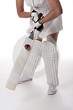 Cricket equipment worn by a female cricketer