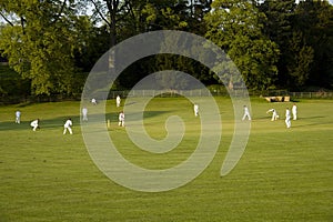 Cricket match on a summer evening ashford in the water peak dist
