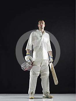 Cricket Player Holding Bat And Helmet