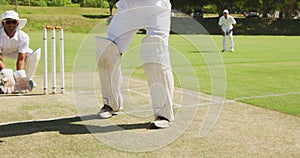 Cricket player shooting in the ball in a pitch