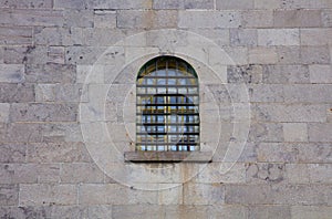 Jail window stone wall prison criminal incarceration crime lock photo