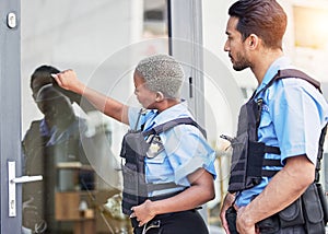 Crime, patrol and police knocking on a door for justice, security and law at a home. Together, teamwork and a black