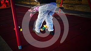 crime scene in a children's playground, where a child was kidnapped. the police present to catalog the evidence