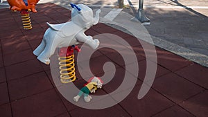 crime scene in a childrens playground, where a child was kidnapped. the police present to catalog the evidence