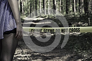 Crime Scene Do Not Cross. Woman in the woods