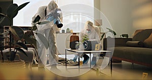 Crime scene, photography and people in house for evidence, investigation and inspection. Law enforcement, forensic