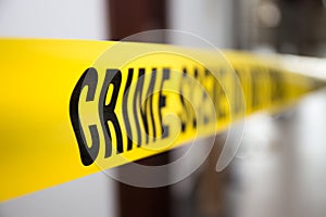 Crime scene tape in building with blurred background