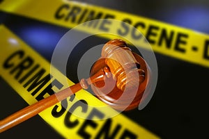 Crime scene tape and gavel