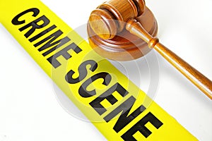 Crime scene tape and gavel