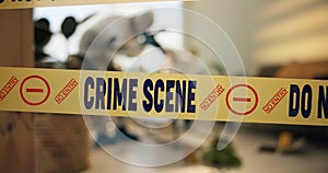 Crime scene tape, photography and people in house for evidence, investigation and inspection. Law enforcement, forensic