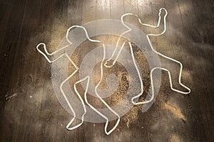 Crime scene with victim outlines on ground