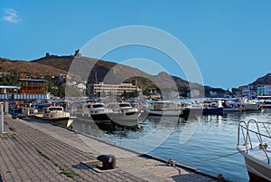 Crimea. Balaclava on the background of the ruins of the fortress Chembalo