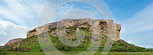 Crimea (Ukraine) landscape with mountain and valley. In stony mountain vertical slope - ancient cave settlement