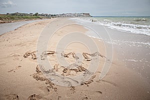 Crimea is Ukraine sign on the sand photo