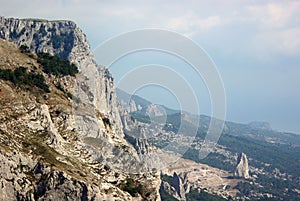 Crimean mountains with view to Uzun Tash rock and quarry at Kuchuk-Koi landslide