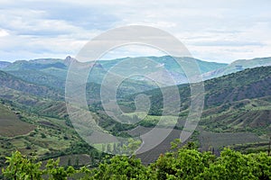 Crimean mountains with vineyards on a cloudy, rainy day