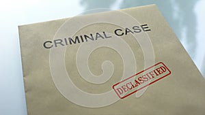 Criminal case declassified, seal stamped on folder with important documents photo
