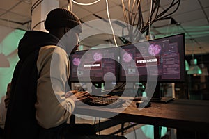 Criminal cyberattack, hacker accessing computer system, password cracking software