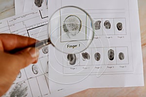 Criminal fingerprint card and magnifier Criminal investigation