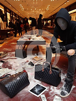 criminal looter rob vandalize retail shop , steal merchandise. graffiti activism paint and break all