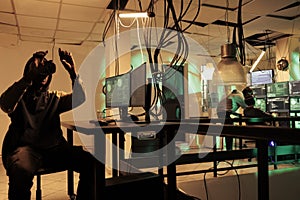 Criminal programming computer virus program in vr helmet