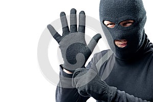 The criminal puts on a glove