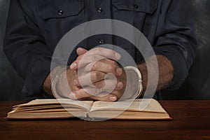 Criminal reads a law book