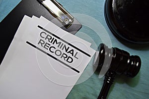 Criminal Record text on Document and gavel isolated on office desk.