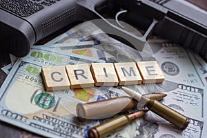 Criminal sign and black gun on usa dollars background. Black market, contract killing, mafia and crime concept